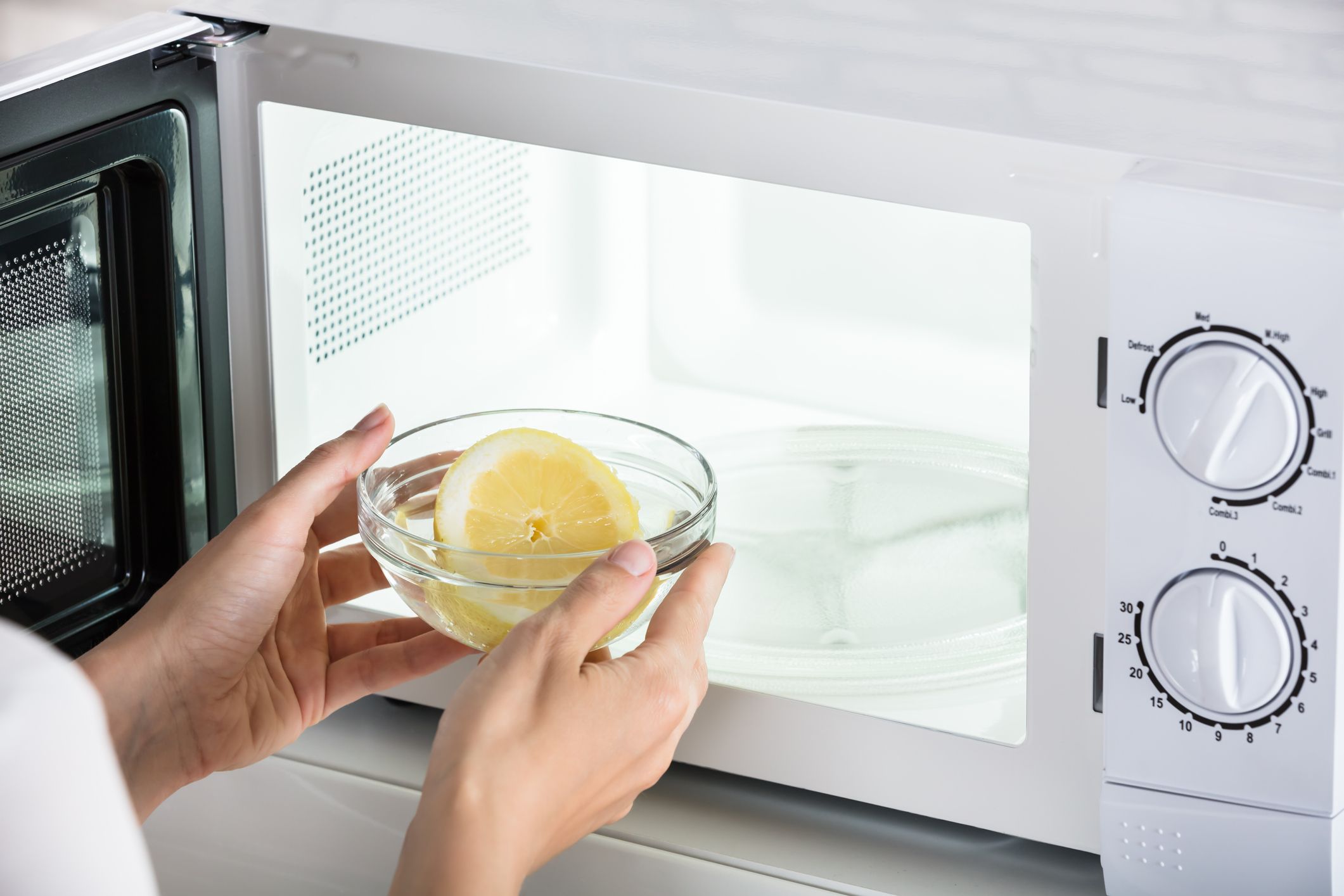 https://www.dialanangelperth.com.au/wp-content/uploads/2020/08/woman-putting-bowl-of-slice-lemon-in-microwave-oven-royalty-free-image-1578044356.jpg